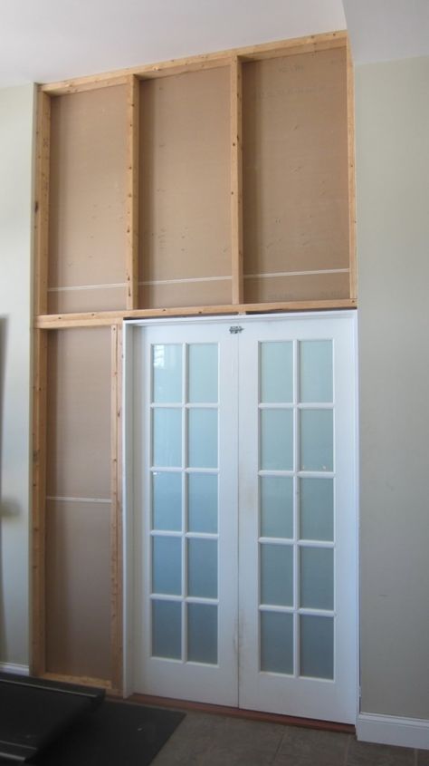 You can see the "bones" of the wall that was created to transform an open archway into a wall with a door. Photo Credit: Tim Carter Adding Door To Opening, Adding A Door To An Opening, Unique Garage Doors, Garage Door Opener Installation, Door Header, Garage Door Types, Building A Door, Open Bathroom, Make A Door