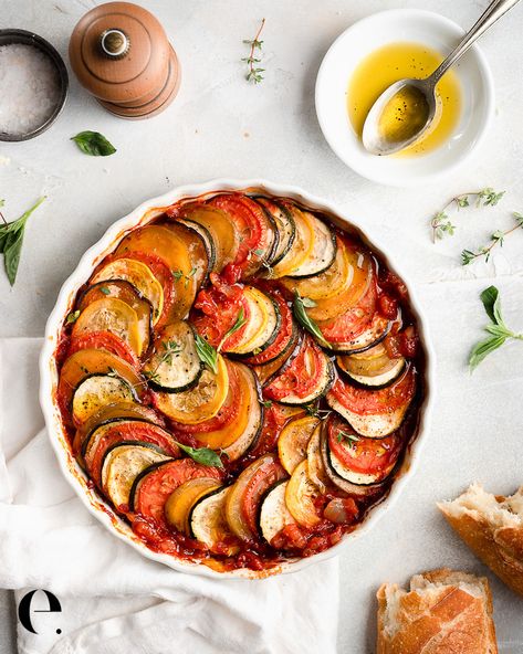 This gorgeous, good-for-you baked ratatouille dish is super easy to make! I cook it low and slow for the best texture, but the hands-on time is minimal. Serve it warm out of the oven with a crusty baguette on the side – and maybe a sprinkling of fresh Parmaman cheese. Or try it over quinoa or farro. It’s delicious when paired with a cooked protein, like roast chicken. Elizabeth Rider Healthy Recipes #ElizabethRider Ratatouille Dish, Ratatouille Recipe, Ceramic Baking Dish, Dinner Party Menu, Vegetable Dishes, Ratatouille, Croissant, K Pop, Baked Dishes