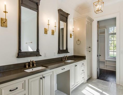 Gold and gray bathroom features a long gray washstand topped with dark gray quartz fitted with his and hers sinks and antique brass vintage style faucets under late 19th century architectural windows, Restoration Hardware Trumeau Mirrors, illuminated by Right Angle Single Wall Lights and a Darlana Lantern. Restoration Hardware Bathroom, Mirror Restoration, Master Bath Layout, Restauration Hardware, Restoration Hardware Paint, Large Bathroom, Trumeau Mirror, Cottage Bathroom, Bathroom Wall Cabinets