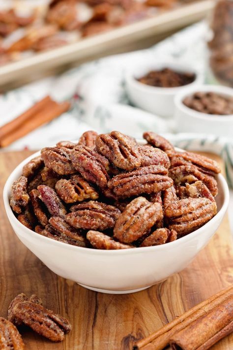 Candied pecans are one of those truly popular snacks for the festive season and sometimes other parts of the year as well. They date back all the way to 1636 and have only increased in popularity since.This classic Candied Pecans recipe is a great addition to your Holiday festivities. Great as a crunchy snack, on salads, as part of a charcuterie board or as a homemade gift. Made with cinnamon sugar and a few other warm spices, this EASY and simple recipe is sure to be a hit! Paleo Candied Pecans, Paleo Candy, Cinnamon Sugar Pecans, Sugar Pecans, Candied Pecans Recipe, Sugared Pecans, Salad Toppers, Homemade Food Gifts, Spiced Pecans