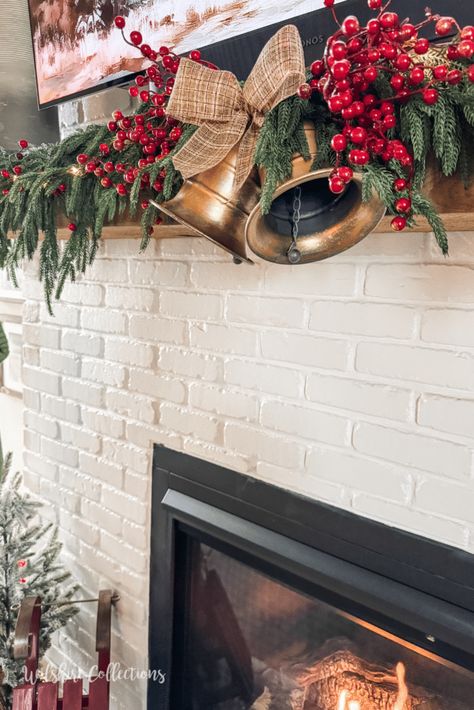 How to decorate a mantel with a TV for Christmas How To Decorate A Mantel With A Tv, How To Decorate A Mantel For Christmas, Christmas Mantel With Tv Above, How To Decorate Mantle With Tv Above It, Decorate Mantel For Christmas, Fireplace Mantel Christmas Decor, Christmas Mantels With Tv, Under Tv Decor, Mantle With Tv