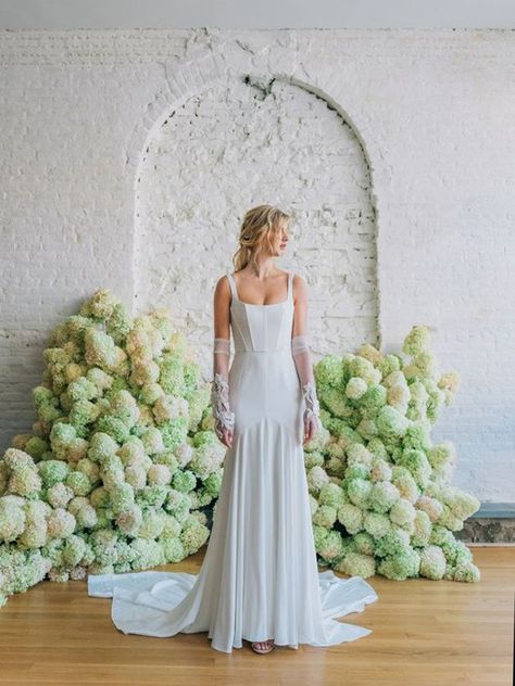 When you think corsets, you think dainty ladylike girls. But, this structured bodice has got some funk. This wedding dress by Carol Hannah has those feminine elements, but done in a rock star way. She even has arm warmers and tousled hair.  Click to see more fun, non-traditional wedding dresses selected from the bridal Fall 2020 season by destination wedding planner, Mango Muse Events! Carol Hannah Bridal, Chic Wedding Gown, Carol Hannah, 2020 Wedding Dresses, Rehearsal Dinner Dresses, Destination Wedding Dress, Beaded Tulle, Tea Length Wedding Dress, Traditional Wedding Dresses