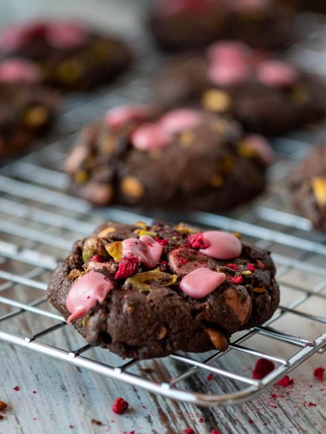 These ruby chocolate chip cookies have ruby chocolate, pistachios and dried raspberries combined in a chocolate cookie base! They have a soft center and crisp edges for a delicate fruity flavor that is out of this world!. Try some ruby chocolate today for a new and different twist on classic chocolate chip cookies. Heath Bar Cookies, Classic Christmas Cookies, Italian Ricotta Cookies, Ruby Chocolate, Chocolate Christmas Cookies, Cookie Base, Pistachio Cookies, Ruby Tuesday, Raspberry Cookies