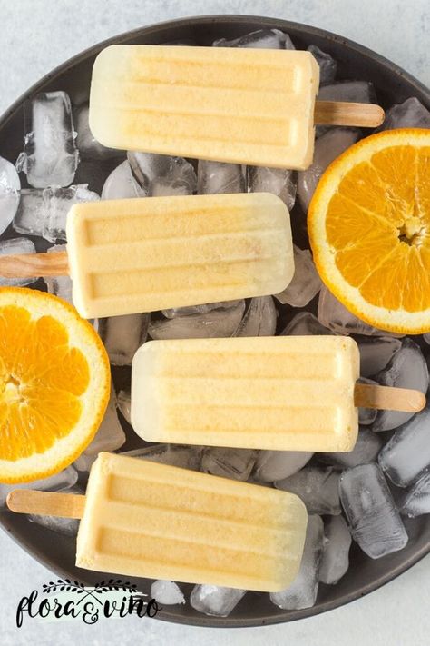 Refreshing orange coconut creamsicles made with orange juice, coconut cream, and a touch of maple syrup. I made mine with orange juice because I love the combination of oranges and cream, but this popsicle blueprint recipe will work with any fruit juice! The perfect healthy treat to beat the heat! | Dessert Recipes | Flora Orange Popsicles, Ice Lollies, White Inspiration, Healthier Desserts, Slow Cooker Desserts, Homemade Popsicles, Ice Pop, Peaches And Cream, Ice Lolly