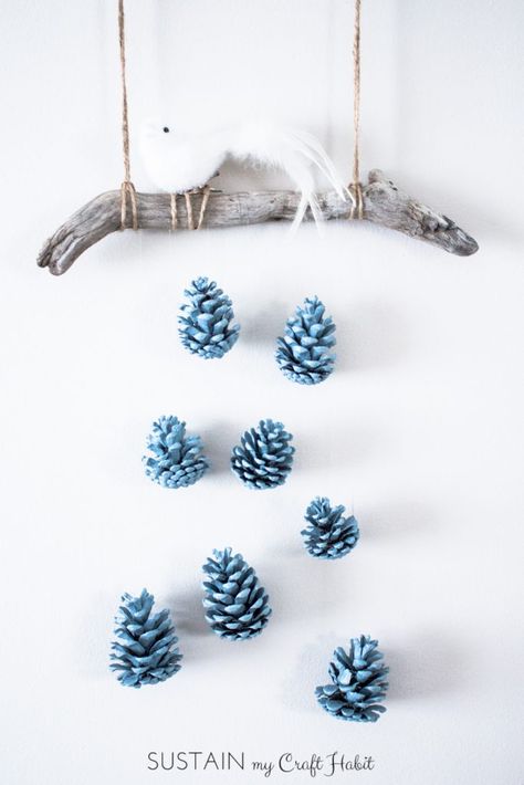 A beautiful bird perched above a cascading array of robin's egg blue pinecones makes a beautiful, inexpensive and easy rustic DIY wall art idea. Check out the detailed step-by-step tutorial. Rustic Wall Decor Diy, Wall Art Idea, Pinecone Crafts Christmas, Candy Corn Decorations, Painted Pinecones, Rustic Wall Hangings, Diy Pinecone, Diy Wand, Pinecone Ornaments