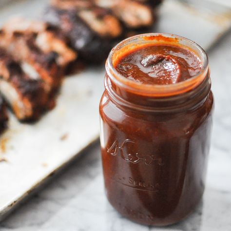 mason jar full of paleo barbecue sauce on a marble table with ribs blurred in the background Paleo Bbq Sauce, Homemade Barbecue Sauce Recipe, Paleo Bbq, Bbq Sauce Homemade Easy, Paleo Barbecue Sauce, Homemade Bbq Sauce Recipe, Paleo Sauces, Homemade Barbecue, Fed And Fit