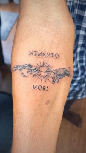 Hand Tattoos For Guys Meaningful, Angle Chest Tattoo Men, Memento Mori Design, Memento Mori Hand Tattoo, Meaningful Forearm Tattoo For Men, Memento Mori Tattoos, Small Tattoo Man, Small Tattoos For Men Forearm, Memento Mori Tattoo Design