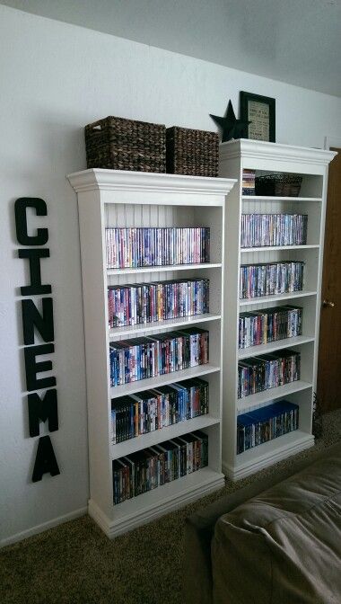 Movie Wall/DVD Storage. Love the use of the craft letting on the wall. Find your ideal lights for your home cinema here: http://www.shinelighting.co.uk/all-lighting/interior-lighting/wall-lights Movie Storage Ideas Dvd Organization, Dvd Shelf Ideas, Dvd Storage Ideas, Dvd Storage Cabinet, Movie Storage, Diy Dvd Storage, Diy Dvd, Ikea Storage Boxes, Room Movie