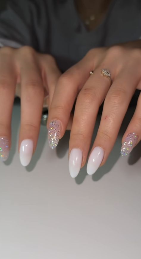 Simple Nail With Glitter, Simple Nail Glitter Design, New Years Nail Ideas Almond, White Nails With Sparkle Accent Nail, White And Glitter Nail Designs, White And Sparkle Nails, Sparkly White French Tip Nails, White Gel X Nails, Simple Sparkle Nails