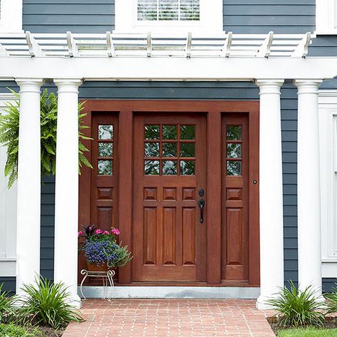 An American Classic. I love the blue gray paint color, thick white trim and rich colored wood with brick. House Doors Front Entrance Classic, Colonial Front Door, Paint Trim, Traditional Front Doors, Wood Front Doors, Gray Paint, House Front Door, Front Door Colors, Front Door Design