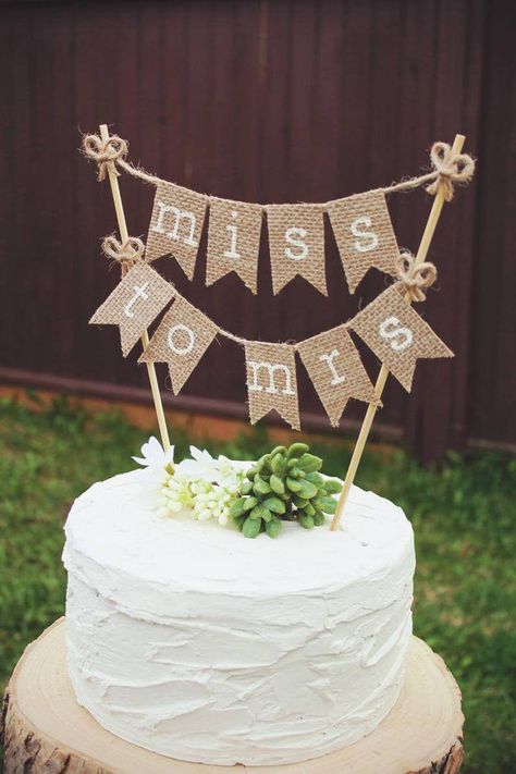 This Miss to Mrs cake topper is our favorite new… Miss To Mrs Cake, Bridal Shower Cakes Rustic, Burlap Wedding Cake, Burlap Cake, Wedding Shower Cakes, Outdoor Bridal Showers, Bridal Shower Cake Topper, Rustic Wedding Showers, Country Wedding Cakes