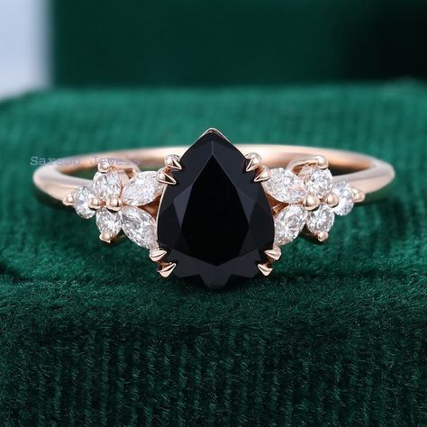 Welcome Over Shop for vintage Jewelry (Please confirm your US size when you make an order) CENTER STONE: Black Onyx SIZE: 6*8mm SHAPE: Pear SIDE STONES: Moissanite or Natural Diamonds CARAT: 0.25ct (High Quality) CLARITY: SI-VS COLOR: G-H Total weight: 2.4g Purchase Guarantee: 1: Provide you with the best service. 2: 14 Day Refund Guarantee. 3: Free Gift Box& Packing 4: Free Shipping and insurance to All Parts Of The World. Accessories: beautiful Ring box, and little gifts. Processing time: When we receive payment We need 2-3 weeks to work for your items in perfect by hand. Please contact us if you need service: 1: Engraving Ring ( less than 10 letter ) 2: Metal Change(10k/14k/18k White/Yellow/Rose Gold) 3: Resizing. 4: Customize your unique jewelry. Thanks Claw Prong Engagement Ring, Nature Engagement Ring, Prong Engagement Rings, Black Onyx Engagement Ring, Onyx Engagement Ring, Pear Shaped Ring, Detailed Engagement Ring, Engagement Ring Rose Gold, Side Stone Engagement Ring