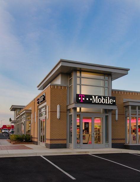 This 4-unit, 6,000-square-foot retail development becomes the catalyst for Prince George’s County’s current small area plan for converting an underserved commercial stretch of suburban roadway into a denser, urban-style setting. The new building occupies the prominent corner of an existing retail shopping center while its site design includes extensive landscaping and storm water retainment/management. The Stripmall Architecture, Front Building Design, Restaurant Exterior Design, Mall Facade, Office Warehouse, Warehouse Space, Storm Water, Retail Facade, Commercial Design Exterior