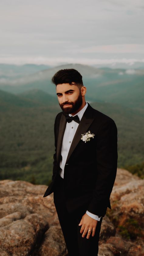 Groom on a mountaintop wearing a tuxedo Wedding Outfit Groom, Groom Outfit Inspiration, Mountaintop Wedding, Hiking Elopement, Mountain Top Wedding, Suit Tuxedo, The Adirondacks, Elopement Ceremony, Mountain Peak