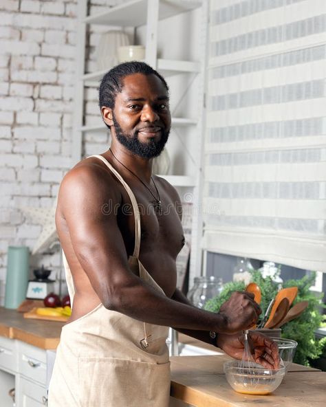 Black man cooking breakfast or lunch on kitchen at home. African American man wearing an apron preparing fresh . stock photo Men Cooking, Home Cake, Insta Image, Cooking Breakfast, African American Man, Man Cooking, An Apron, Black Man, Black American