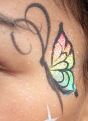 Pretty sparkly rainbow butterfly face paint. Butterfly Eye Face Paint, Butterfly Makeup Easy, Butterfly Face Paint Easy, Pride Face Paint, Horse Face Paint, Cony Island, Jungle Camp, Rainbow Face Paint, Butterfly Face Paint