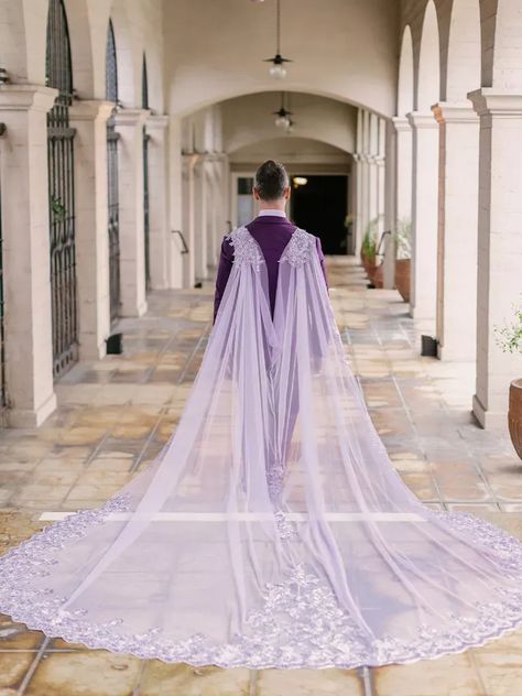 Lavender tulle cape at fairytale-inspired wedding Lavender Wedding Gown, Wedding Gown With Cape And Veil, Lavender Wedding Dress With Sheer Dupatta, Lavender Cape Dress, Silver Wedding Dress With Cape, Cape Veil Wedding, Hooded Wedding Veil Bridal Cape, Veil Fashion, Purple Veil