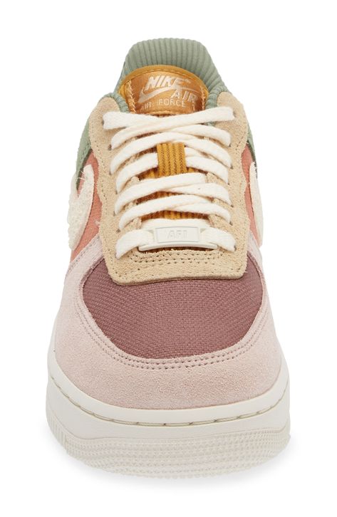 The basketball shoe that started a sensation keeps shooting and scoring as a street sneaker sporting layers of plush suede and colorblocked canvas. The iconic Air Force 1 sole features embedded Nike Air cushioning and crenellations along the tread that frame a star-studded bumper toe. Lace-up style Removable insole Leather, synthetic and textile upper/textile lining/rubber sole Imported Nordstrom x Nike: A curated lifestyle destination where fashion is the ultimate sport Cute Tennis Shoes Nike, Nike Fall Shoes, Basketball Shoes Outfit Women, Green Air Force 1 Outfit, Colorful Airforce, Fall Platform Shoes, Unique Sneakers Women, Womens Lifestyle Sneakers, Women’s Fashion Sneaker