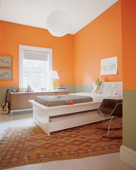 Kid's bedroom with a twin bed and guitar and half wall painted in Benjamin Moore Calypso Orange Orange Kids Rooms, Best Bedroom Paint Colors, Orange Rooms, Bedroom Color Combination, Kids Room Paint, Bedroom Orange, Fall Bedroom, Orange Walls, Bedroom Paint Colors