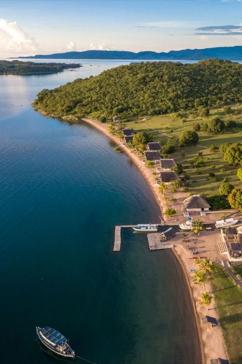 Secluded Lake Shore Lodge is located on the beach of magical Lake Tanganyika, not far from Mahale Mountains and Katavi National Park Magical Lake, Monkey Species, Lake Tanganyika, Tanzania Travel, Tanzania Safari, Clear Blue Water, Lake Shore, Green Mountain, Tanzania