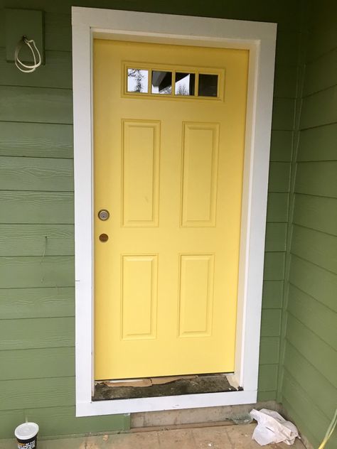 (Yellow)Daffodil door with (green) artichoke paint by Sherman Williams Green House Yellow Door, Exterior House Paint Colors, House Doors Colors, Sage Green House, Yellow Front Door, Green Exterior House Colors, Green House Exterior, Green Siding, Orange Front Doors