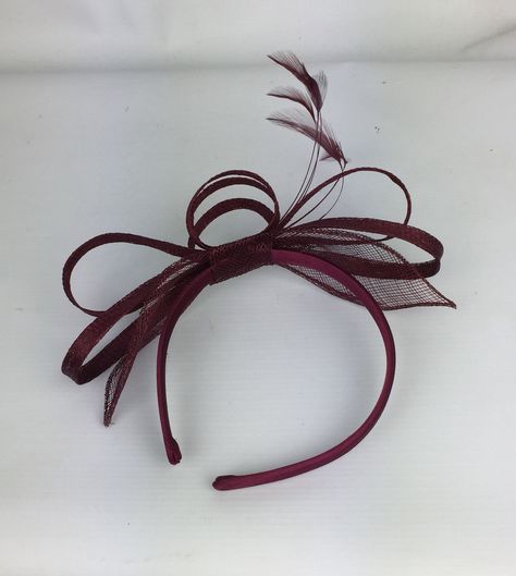 Pretty Elegant Burgundy / Wine / Merlot fascinator for a wedding, mother of the bride or guest, a day at the races, a tea party, bbq, dinner dance or a memorable occasion, garden parties, hen night, etc This is a simple Pretty and Elegant sinamay loop & leaf fascinator with feather detail to compliment your outfit. This quality fascinator is mounted on a 1.3 cm satin headband so is comfortable to wear. The fascinator can be moved along the headband so can be adjusted to position in varying angle Burgundy Fascinator, Maroon Hat, Ascot Ladies Day, Green Fascinator, Wedding Mother Of The Bride, Red Fascinator, Bbq Dinner, Pink Fascinator, Occasion Hats