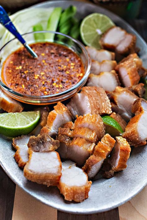 Try Thai Crispy Pork Belly for a delicious and crispy meal. It's easy to make and full of authentic Thai flavors. Get ready to enjoy the taste of Thailand in just a few simple steps. Only 5 ingredients! #crispyporkbelly #thaiporkbelly #porkbellyrecipes #crispythaiporkbelly #crispyfriedporkbelly #porkbellyrecipe #thaiporkbellyrecipe #easyporkbelly #crispyporkbellyrecipes Thai Fried Pork Belly, Thai Food Authentic, Pork Belly Recipes Crispy, Thai Appetizer, Pork Belly Bao, Thai Flavors, Fried Pork Belly, Spicy Dipping Sauce, Pork Belly Recipes