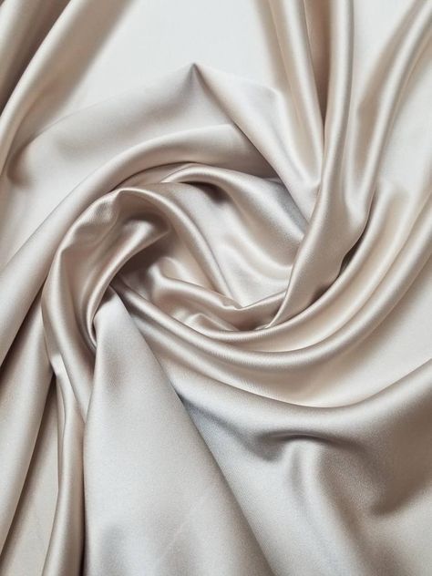 "Beige champagne color fine satin fabric. Usable for apparel,accessories and interior designing. Beautifully made to use for costumes, decorations, weddings and much more. Width : 60\" inches Color : Khaki / Beige /champagne Content : Polyester Thank you for your coming! Please read policy before placing an order. Please contact us via ETSY Conversations for more details. Fabrics are sold by the yard. We will continue length of multiple yards . It will come in one piece of the multiple yards you