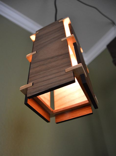 This is a simplistic but beautiful wooden pendant light. With classic lines from the craftsman era, this stunning light fixture will brighten up any room.