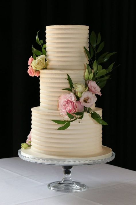 3-tier ribbed wedding cake with pink flowers Simple Elegant Wedding Cakes 3 Tier, 3 Tier Wedding Cake Elegant, Simple 3 Tier Wedding Cake, Gray Wedding Cake, Buttercream Wedding Cakes, Couple Wedding Invitation, Elegant White Wedding, 4 Tier Wedding Cake, Silver Wedding Cake