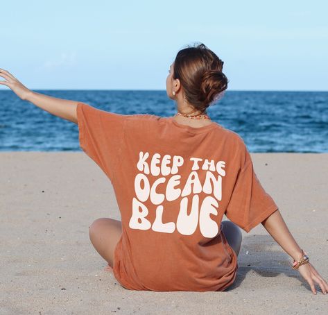 Make a statement with our retro 'Keep the Ocean Blue' tee! Featuring a bold back print and a classic fit, this shirt is perfect for the beach or the streets. Show your love for the ocean and spread awareness with this stylish tee. #oceanlove #savetheocean #ecofriendlyfashion #sustainablefashion #beachwear #statementtee #oceanconservation #marineconservation #savethesea #protectouroceans #naturelover #oceanblue #beachlife #summerfashion #graphictee #oceanawareness #savetheearth #plasticfreeoceans Retro Ocean, Sea Turtle Shirt, Turtle Shirts, Ocean Grove, Mrs Shirt, Beach Tee, Comfort Colors Tshirt, Shark Shirt, Trendy Summer Outfits