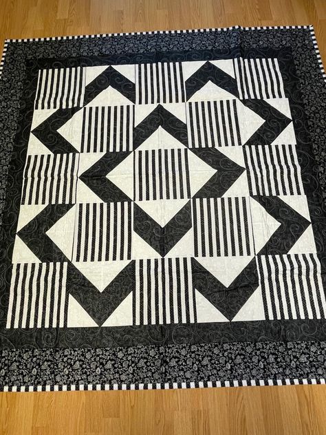 This quilt is Contemporary with its black and white stripes. Free shipping with USPS Priority Mail. It measures approximately 68x68 inches. Washer friendly using a cold wash...toss into dryer for a few minutes to fluff it out. Double bound for lasting wear...square...sewn with tight seams...long armed beautifully. The quilt top, batting and backing are all made from new 100% cotton material...would make a fantastic bed runner...bridal shower gift or a unique wedding gift...a keepsake for sure. Thank you for stopping to shop... Between The Lines Quilt Pattern, Modern Quilt Patterns Easy Free, Striped Fabric Quilts, Masculine Quilts Patterns, Black And White Quilts Patterns Ideas, Three Color Quilts, Neutral Quilts Ideas, Quilts For Men, Black Quilts