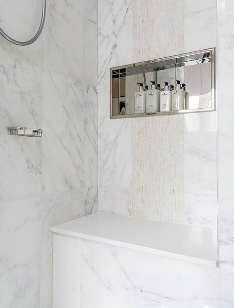 Amazing walk-in shower is clad in marble fitted with a stainless steel niche placed over a shower bench. Stainless Steel Shower Niche, Bathroom Niche, Transitional Contemporary, Transitional Bathroom, Shower Niche, Transitional Living Rooms, Transitional House, Shower Shelves, Trendy Bathroom