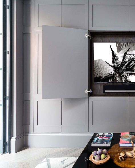 Panelling isn’t just limited to wall panels, push latch handles on bespoke wardrobe and cupboard doors can create the illusion of a seamless wall with hidden away clever storage solutions behind it #storage #interiors #panelling Hang Art Over Tv, Tv Joinery, Small Storage Ideas, Push Latch, Tv Walls, Tv Wall Cabinets, Bespoke Wardrobe, Hidden Tv, Muebles Living