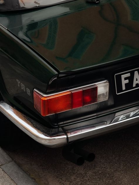 A close up of a car parked on the side of the road photo – Free Green Image on Unsplash Closeup Photography, Road Photo, Triumph Tr6, Close Up Photography, Car Images, Grey Wallpaper, Car Photography, Close Up Photos, Car Photos