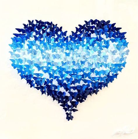 This is a 3d Sculpture Wall Art piece by Israeli artist Joel Amit. It is a 3d heart made from hand painted metal butterflies. The name of the artwork is Flying Love (Blue). The blue heart is made from the butterflies and the white background is painted wood. The colorful butterflies are raised up from the background by a few inches creating a very cool 3d artwork. This piece is part of Joel Amit’s Flying Love series and there are different sizes and color combinations available. Metal Butterflies, Painted Butterflies, 3d Wall Sculpture, Sculpture Wall Art, Sculpture Wall, 3d Sculpture, Metal Fish, Metal Wall Sculpture, 3d Heart