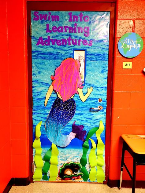 Mermaid classroom door Mermaid Classroom Door, Mermaid Door Decorations, Little Mermaid Classroom Theme, Little Mermaid Bulletin Board, Under The Sea Door Decorations Classroom, Mermaid Classroom Theme, Mermaid Classroom, Teacher Appreciation Door Decorations, Kindergarten Classroom Themes