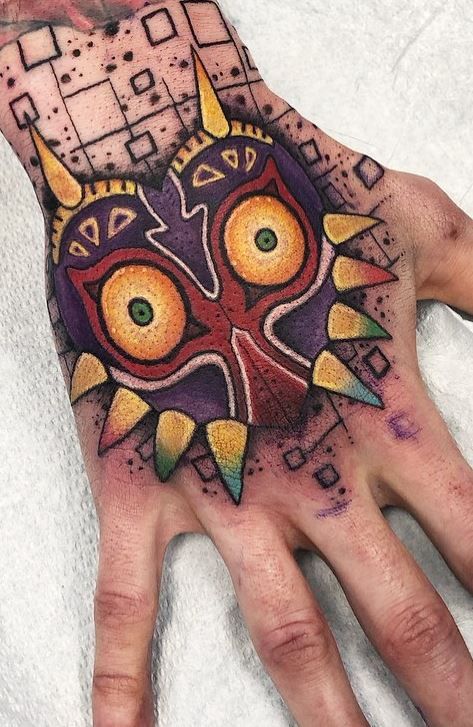 150 Trendy Hand Tattoos for Men You Must See - Tattoo Me Now Trendy Hand Tattoos, Majora's Mask Tattoo, Hand Tattoos For Men, Internet Slang, Nerdy Tattoos, See Tattoo, Gamer Tattoos, Zelda Tattoo, Tattoo Me