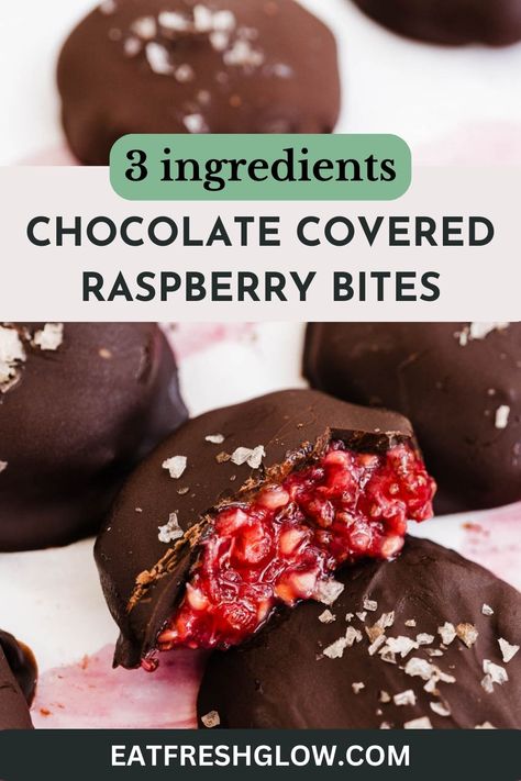 Chocolate raspberry bite cut in half to reveal filling with more bites surrounding. Dark Chocolate And Fruit Healthy Snacks, Healthy Dessert Raspberry, Chocolate Raspberry Clusters, Chocolate Covered Raspberries Recipe, Frozen Raspberry Yogurt Bites, Raspberry Coconut Balls, Healthy Chocolate Covered Fruit, Frozen Raspberry Chocolate Bites, Chocolate Covered Raspberry Bites