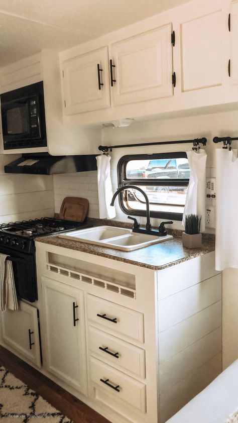 Springdale Camper Remodel, Small Camper Kitchen, White And Black Rv Interior, Black And White Rv Remodel, Black And White Caravan Interior, Black And White Rv Kitchen, Camper Remodel Black Cabinets, Rv White Cabinets, Small Camper Remodel