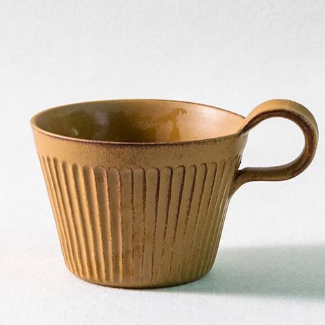 A personable teacup that you can comfortably hold with your index finger while you are looking out of your window at your scenic garden or stunning cityscape view. On top of this, the handle is shaped in a way that makes it poke up above the actual cup.   Apart from giving it a unique appearance, it also means that this tea mug provides an extra sense of enjoying your tea. In the form of feeling the warmth of your beverage.     DETAILS         Product Type:   Mugs & Teacups       Color:   Yellow,Green ,Brown       Material:   Stoneware         WEIGHTS & DIMENSIONS         Weight:   0.65Ib       Diameter:   4''       Height:   3''         NOTE   1 in = 2.54 cm; 1 cm = 0.39 in * Should you require any further information about our products and services, feel free to Contact Us . Cappuccino Cups, Flush Mount Ceiling Fan, Index Finger, Ceramic Mugs, Ceiling Fan With Light, Tea Mugs, Cappuccino, Green And Brown, Cityscape