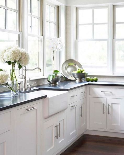 Kitchen:  white shaker cabinets, absolute black granite counters, white farmhouse sink, lots of windows, and flowers. No Upper Cabinets, White Farmhouse Sink, Staging Ideas, Southern House, Black Countertops, Kitchen White, White Sink, Gourmet Kitchen, Kitchen Sinks