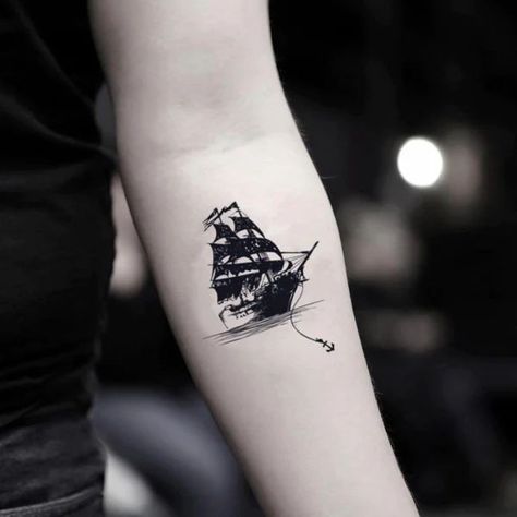 This article contains 60 fully original, distinctive, and eye-catching ship tattoo ideas. Bonus: all meanings explained. Pirate Tattoo Simple, Pirate Boat Tattoo, Ship Reference, Pirate Tattoos, Small Black Tattoos, Sailing Tattoo, Pirate Ship Tattoos, Black Pearl Ship, Pirate Ship Tattoo