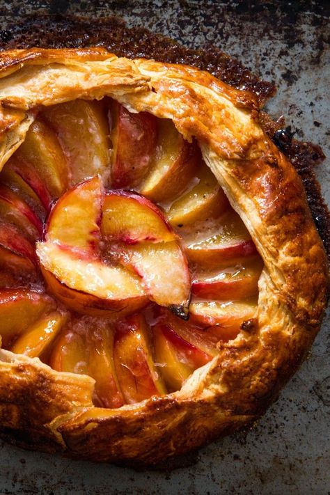 Freeform Peach Pie (Galette) Recipe | Ripe summer peaches don't hold up well in the oven, so it's best to bake them as briefly as possible, which is why I prefer them as an open-faced pie—or galette, as the French would say. Without a pie plate to contend with, the crust bakes so quickly, the peach slices stay wonderfully tender, juicy, and fresh.	  #summerrecipes #seasonal #summerdishes #seriouseats #recipes Open Peach Pie, Open Face Peach Pie, Sweet Pies, Galette Recipe, Summer Baking, Peach Slices, Peach Pie, Summer Dishes, Sweet Pie