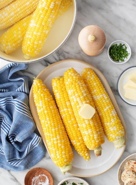 Learn how to boil corn on the cob! It's SO easy, and the corn comes out tender, sweet, and juicy every time. Served with butter, salt, and pepper, it's the BEST summer side dish! Corn In The Cob, How To Boil Corn, Boiled Corn On The Cob, Boiling Corn, Boil Corn On The Cob, Summer Corn Recipes, Salt Potatoes, Fresh Corn Recipes, Grilled Vegetable Skewers