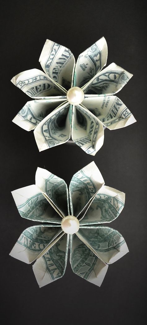 The money flower is a beautiful and easy origami out of two dollar bills. You can use it like a decoration for a graduation lei. The idea and design by Anastasia Prokuda. I wish you a pleasant viewing! Subscribe to my channel! Easy Diy Money Lei Graduation, Folding Dollars Into Flowers, Money Lei Flower, How To Make A Flower Out Of A Dollar Bill, Making Flowers Out Of Money Dollar Bills, Make Flowers Out Of Money, Money Cupcakes Ideas Dollar Bills, Graduation Money Flowers, Origami Flowers With Dollar Bills