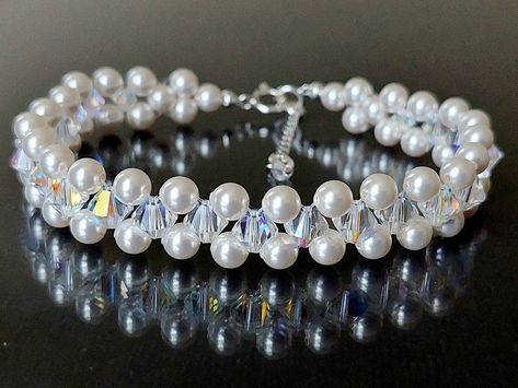 Wedding White Pearl Aurora Borealis Crystal Silver Beaded Bridal Cuff Bracelet. BRACELET is about 7.40 inches (18.8cm) long plus 1 inch extender chain. BRIDAL EARRINGS SECTION: https://www.etsy.com/shop/LanaChayka?ref=seller-platform-mcnav§ion_id=11638940 BRIDAL JEWELRY SETS SECTION: https://www.etsy.com/shop/LanaChayka?ref=seller-platform-mcnav§ion_id=25839214 BRIDAL NECKLACES SECTION: https://www.etsy.com/shop/LanaChayka?ref=seller-platform-mcnav§ion_id=11638944 Elegant and classy, this stunni Diy Pearl Hair Accessories, Bridal Cuff Bracelet, Beaded Wedding Jewelry, Seed Bead Bracelets Tutorials, Bridal Necklaces, Jewelry Necklace Simple, Bridal Cuff, Bridal Bracelet Pearl, Braided Bracelet Diy