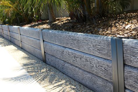 RIDGI Gumtree concrete sleepers. Available in Bunnings stores Australia wide or visit ridgi.com.au Garden Sleeper Ideas, Sleepers Garden Ideas, Sleepers Garden, Concrete Sleeper Retaining Walls, Retaining Wall Fence, Sleeper Wall, Sleeper Retaining Wall, Retaining Wall Steps, Retaining Wall Ideas