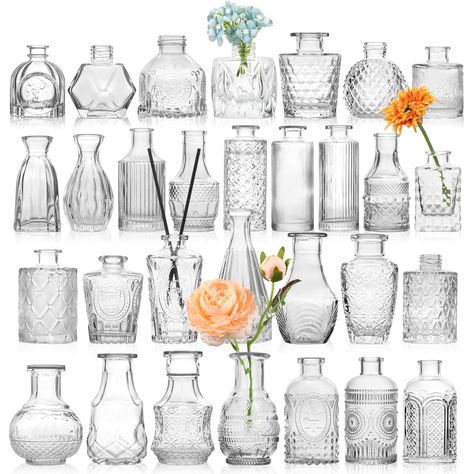 PRICES MAY VARY. Textured: These clear bud vases are made of high quality thick and strong glass, which are durable and not easy to break Sturdy: The small vases for flowers have a stable center of gravity and are not easy to tip over. Each beautiful mini vase has a different design, size, and shape Beautiful present: On Mother's Day, Thanksgiving Day,Valentine's Day, anniversary,Christmas,birthday or Housewarmings,you can give it as a great present to your guests Decorative centerpieces: Decora Vasos Vintage, Wedding Vase Centerpieces, Glass Vases Centerpieces, Mini Vases, Vintage Centerpieces, Small Glass Vases, Clear Vases, Table Flower, Rustic Vase