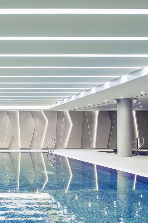 Indoor swimming pool with LED ceiling and wall lighting designs Public Swimming Pool, Smooth Aesthetic, Leicester City Football Club, Hydrotherapy Pool, Indoor Swimming Pool Design, Kindergarten Interior, Leicester City Fc, Indoor Swimming Pool, Suspended Ceiling